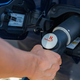 Fueling a car with hydrogen fuel.